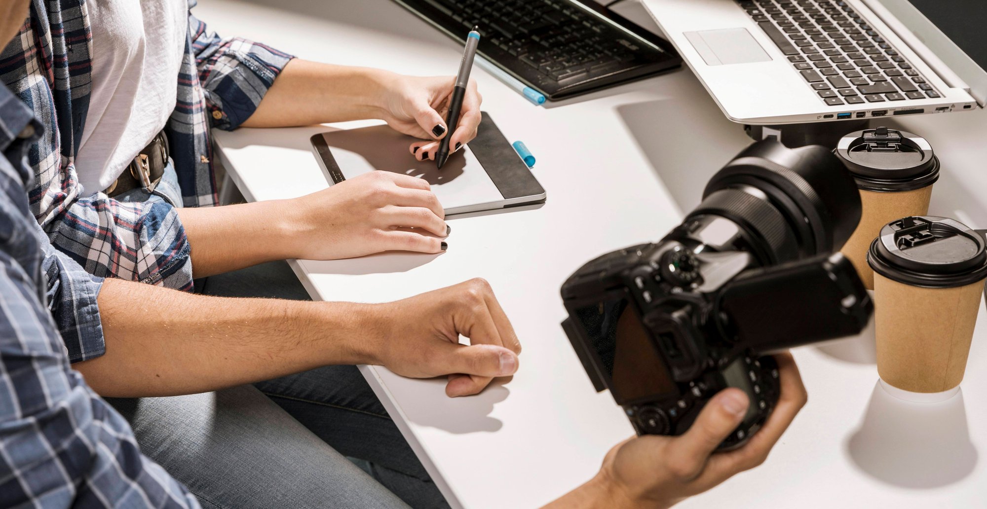 high-angle-man-holding-camera